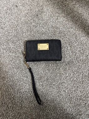 Michael Kors Black Wristlet with Gold Plate
